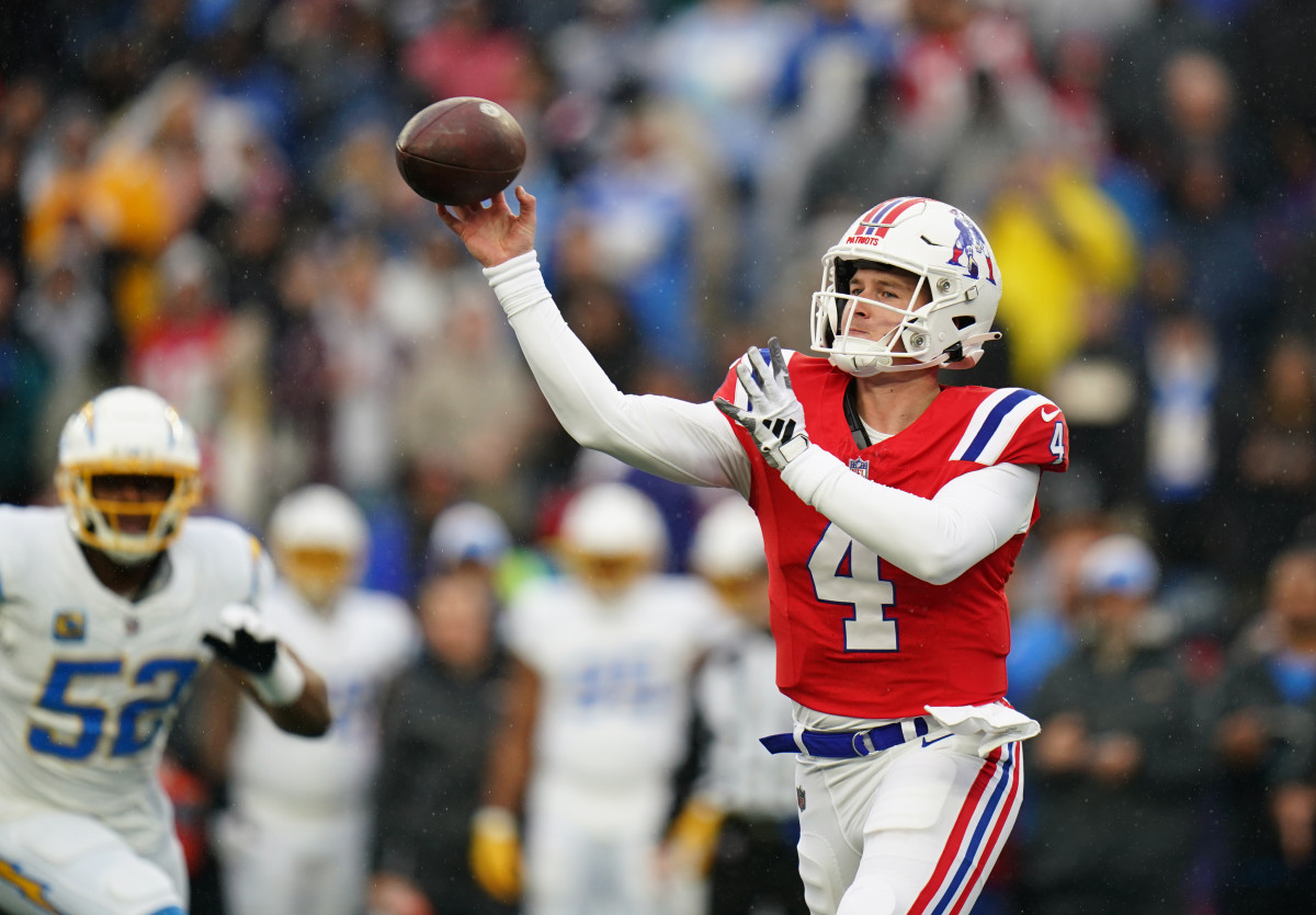 New England Patriots quarterback Bailey Zappe (4) throws a pass against the Los Angeles Chargers in the first quarter at Gillette Stadium.